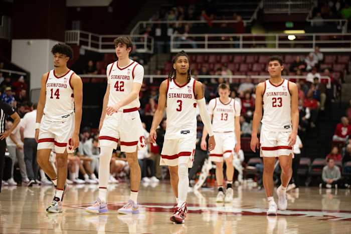 Feb 22, 2024; Stanford, California, USA; The Stanford Cardinal starting five forward Spencer Jones (14), forward Maxime Raynaud (42), guard Kanaan Carlyle (3), guard Michael Jones (13) and forward Brandon Angel (23) walk back onto the court follow a timeout during the first half against the Oregon Ducks at Maples Pavilion. Mandatory Credit: D. Ross Cameron-USA TODAY Sports